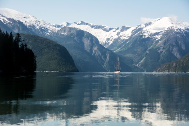 A sailboat in the Kitlope region of the Great Bear Rainforest, British Columbia, Canada.